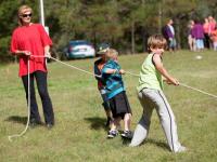 Adults helping kids with the games